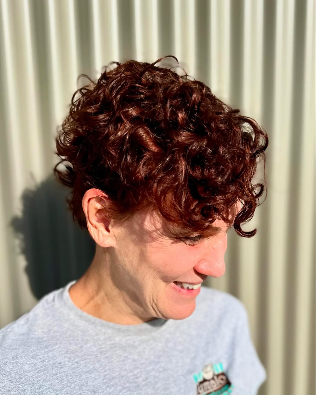 Auburn Curly Pixie with Voluminous Curls