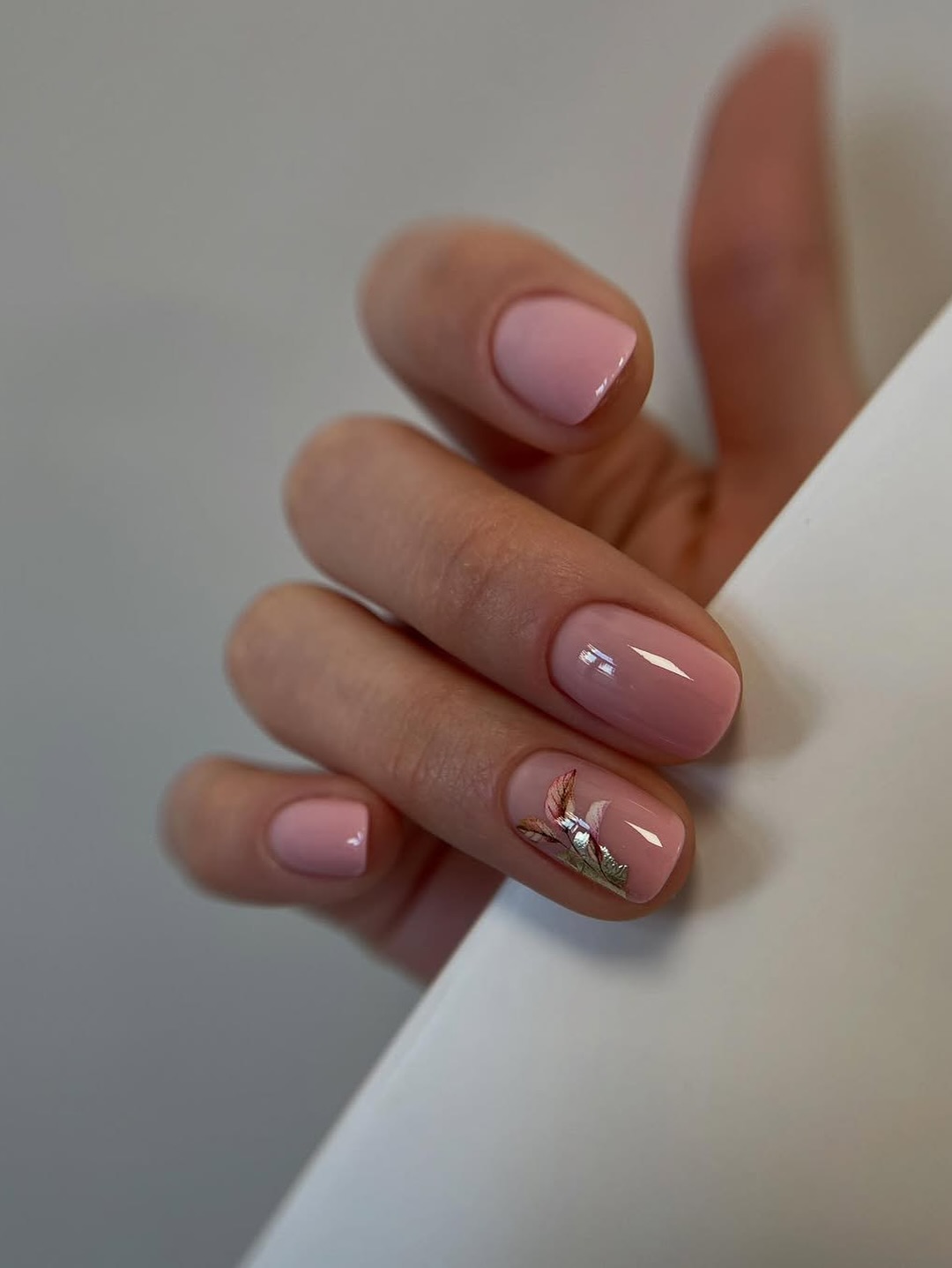 Blush Pink Oval Nails With Metallic Leaf Art