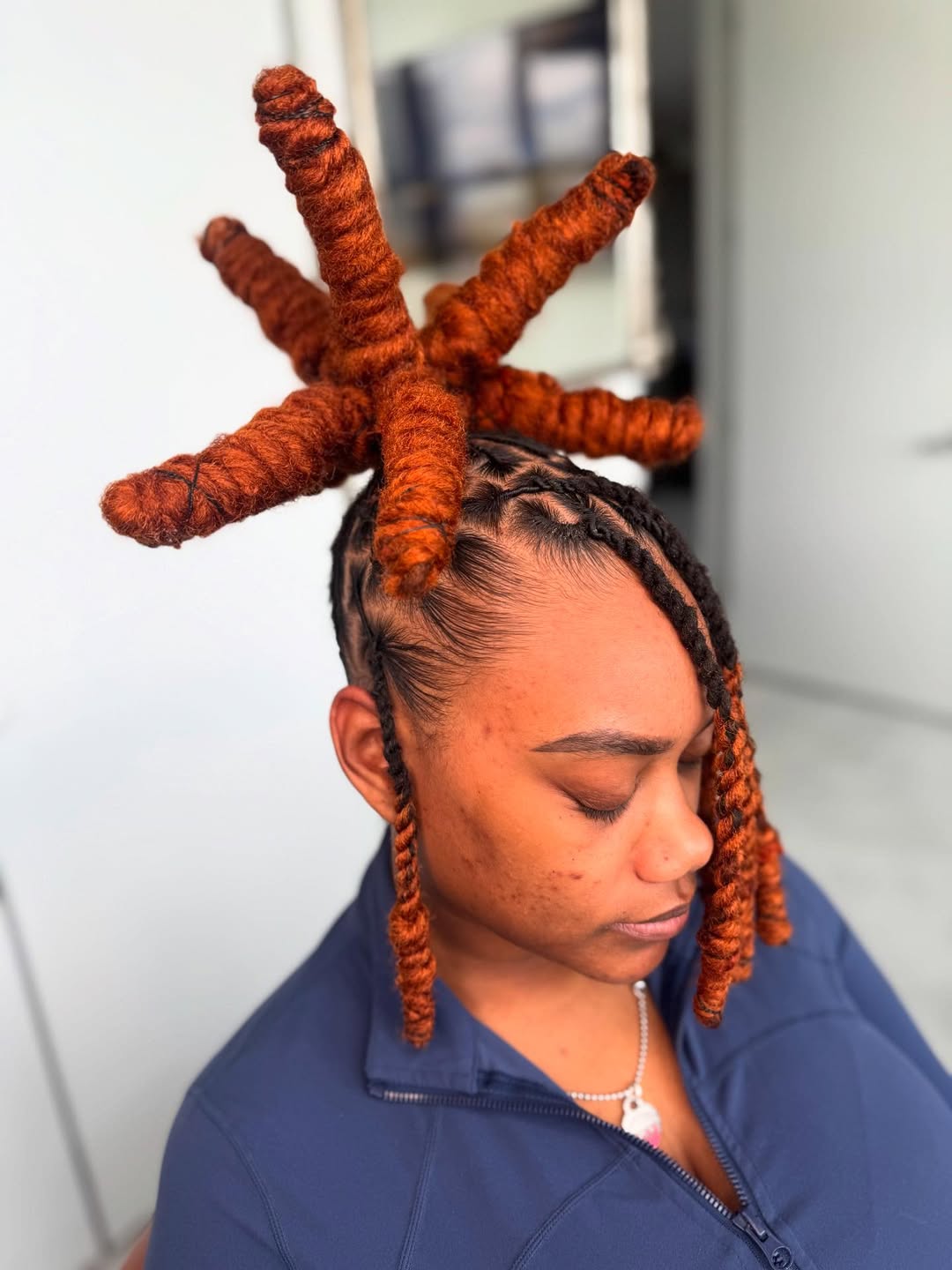 Bold Orange Locs Shaped Like A Starburst