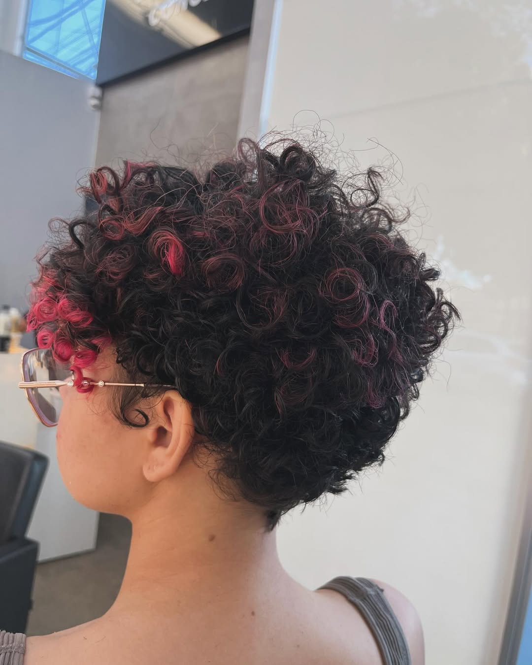 Bold Ruby Red Highlights On Curly Pixie