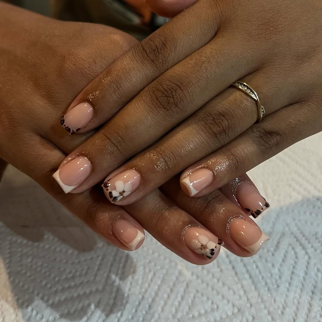 Classic French Tips with Floral Accent and Glitter