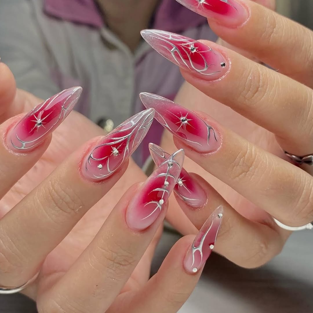 Crimson Flame Stiletto Nails with Silver Accents