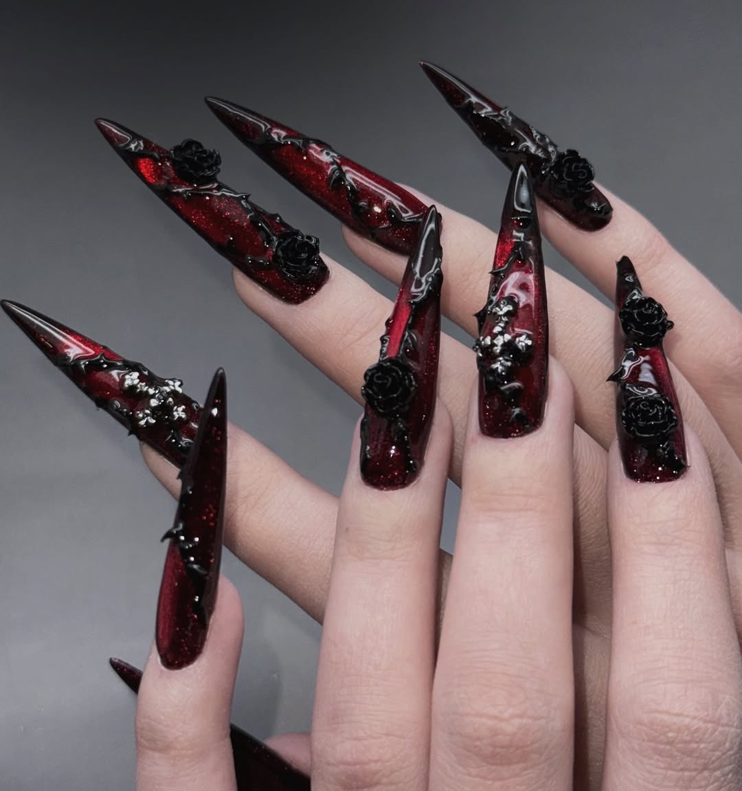 Dark Red Glitter Stiletto Nails with Black Roses