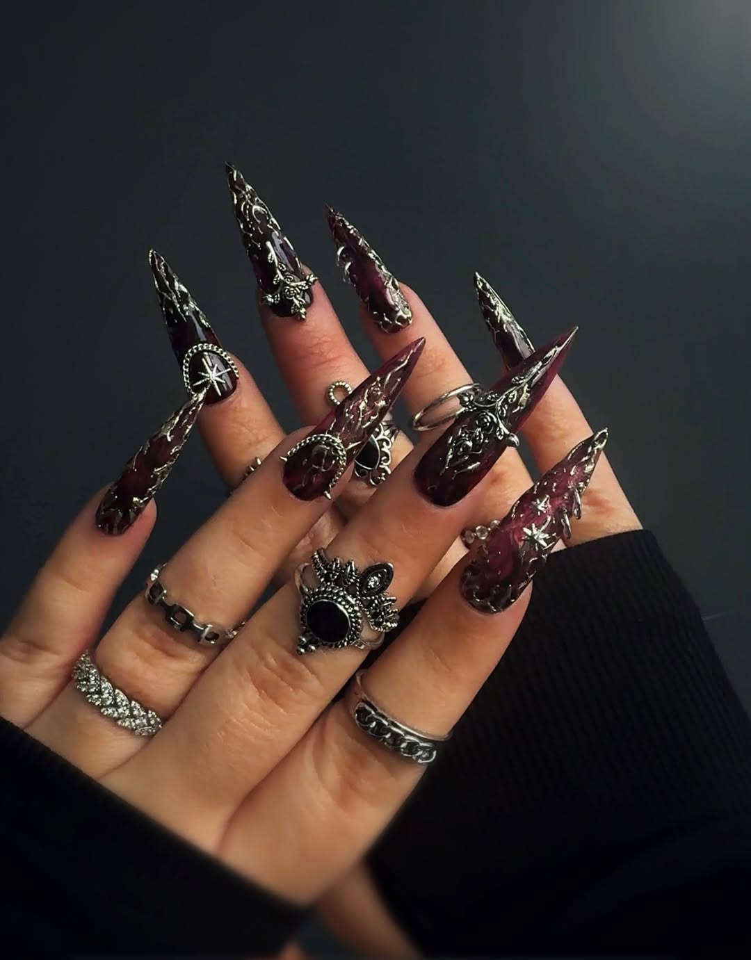 Dark Wine Stiletto Nails With Silver Embellishments