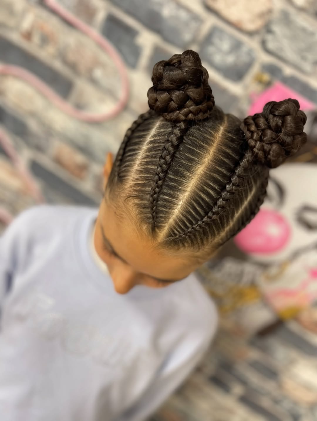 Deep Side Part Cornrows Space Bun Hairstyle