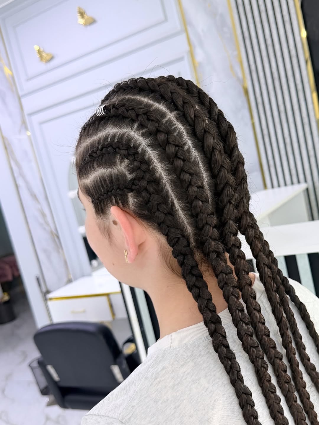 Defined Cornrows With Geometric Parting And Silver Accents