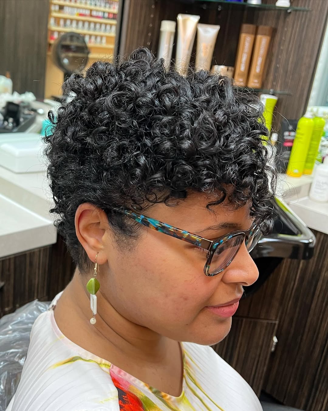 Defined Curly Pixie With Side Swept Bangs