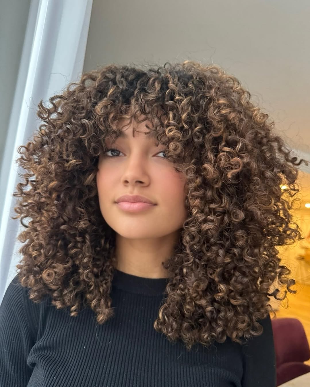 Defined Honey Blonde Curly Shoulder Length Cut