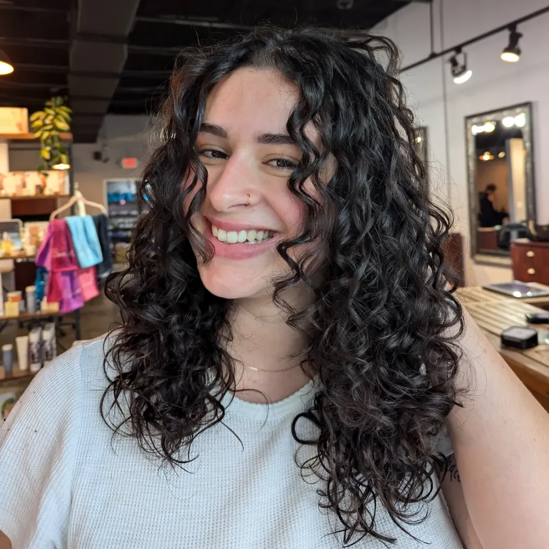 Defined Medium Curly Layers With Subtle Face Framing