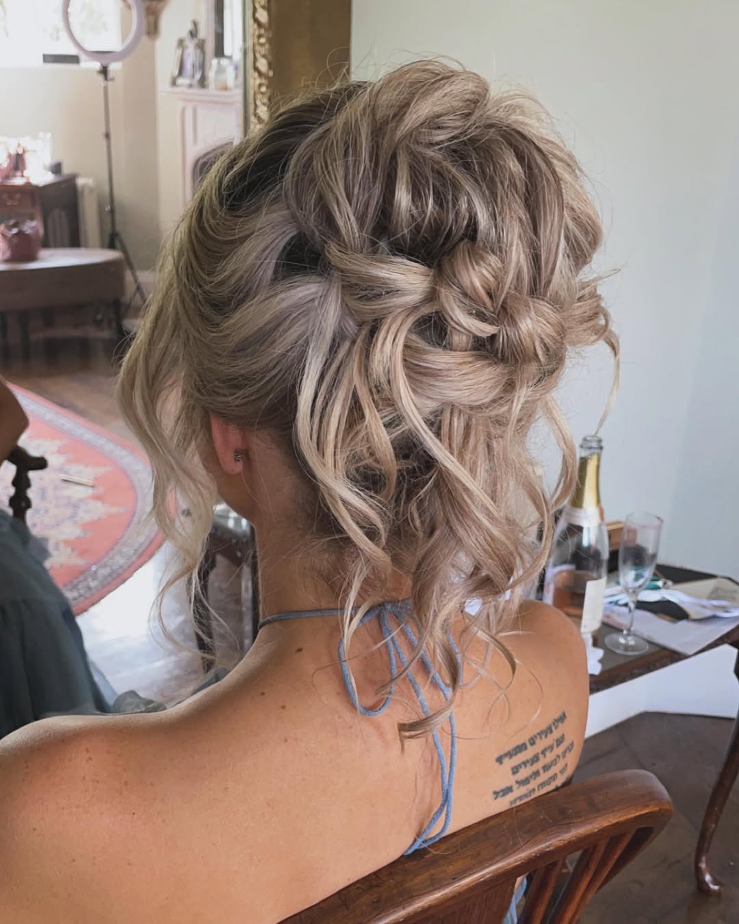 Effortless Boho Braided Updo With Loose Waves
