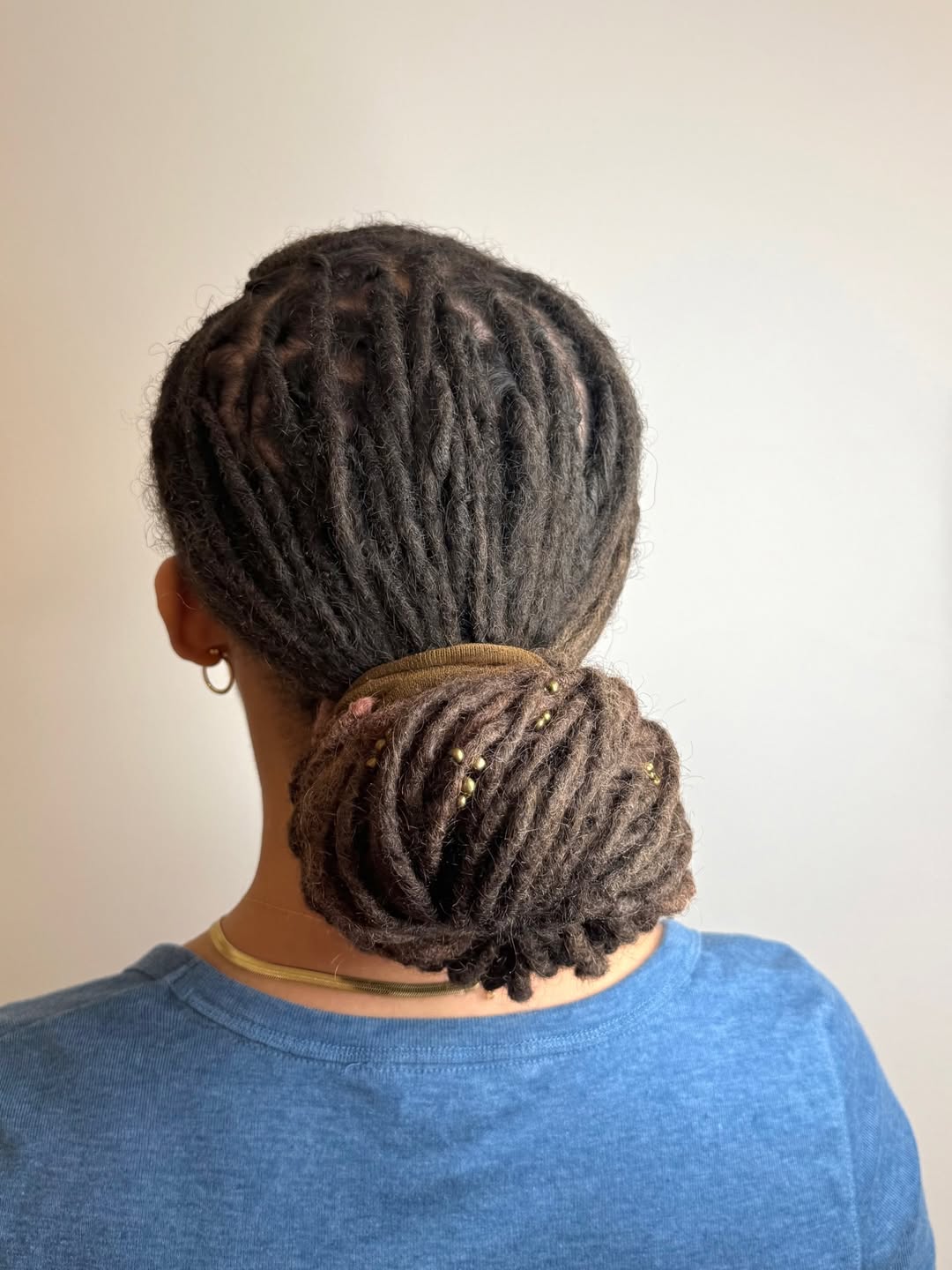 Elegant Locs Bun With Gold Adornments