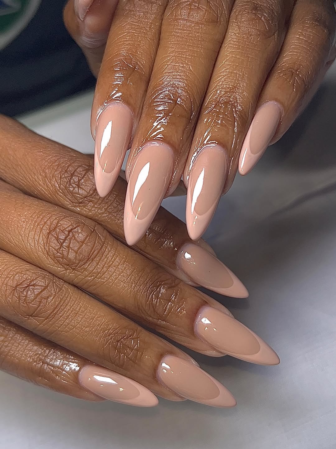 Elegant Nude French Tip Almond Nails