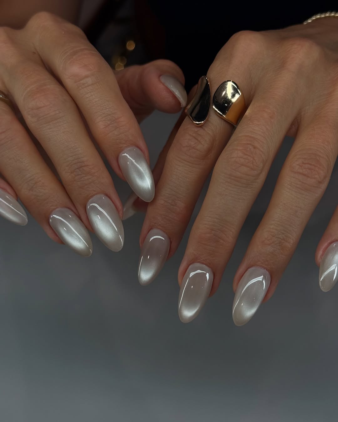 Elegant White Cat Eye Almond Nails