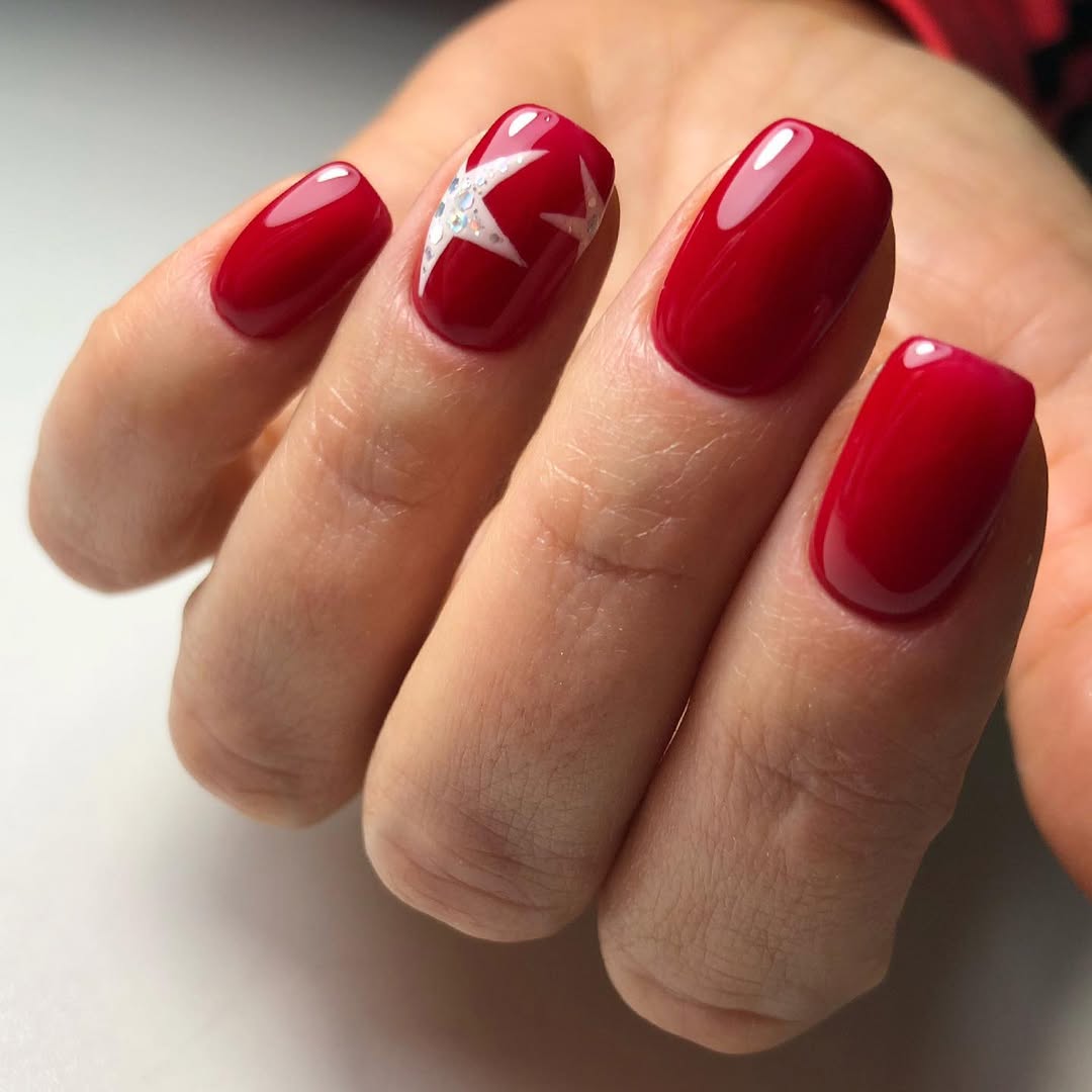 Glossy Cherry Red Star Accent Nails