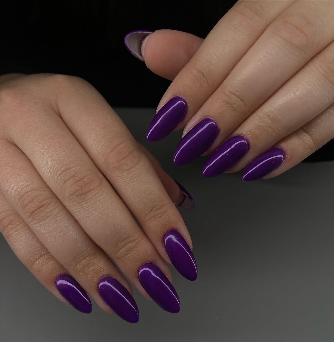 Glossy Deep Purple Almond Nails