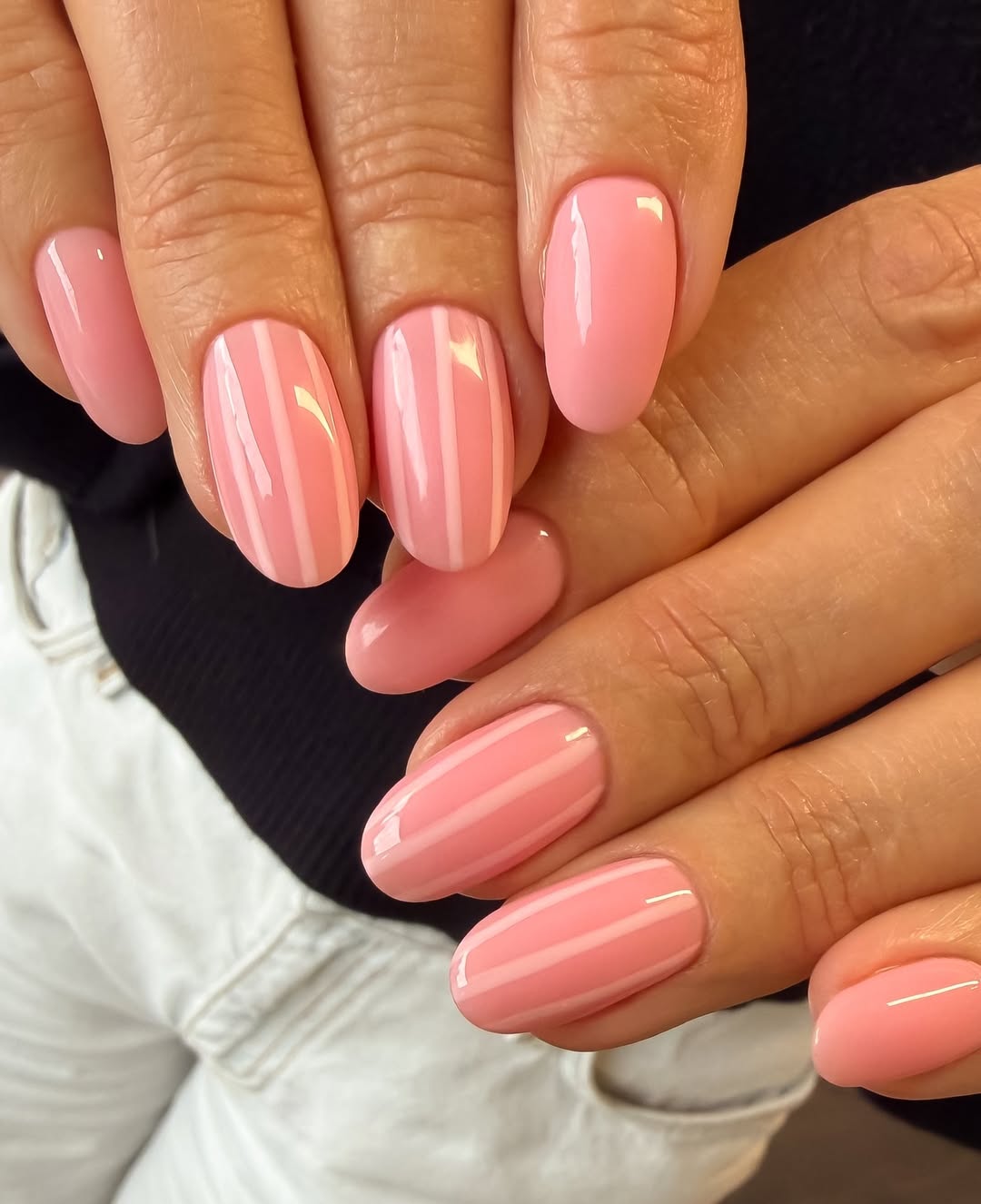 Glossy Peach Pink Oval Nails with White Striped Accent
