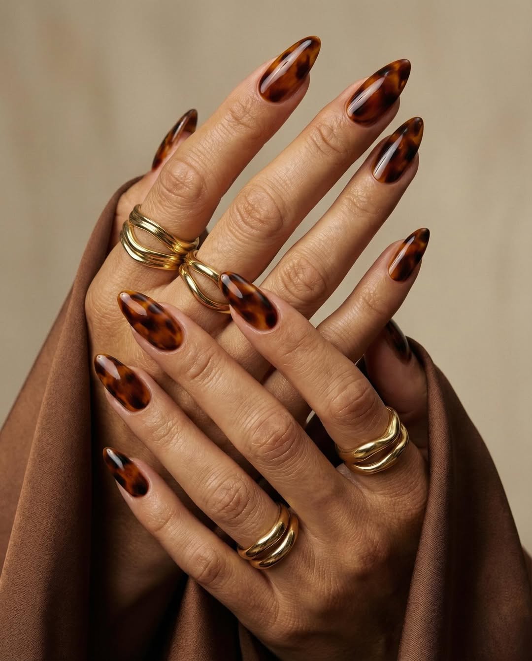 Glossy Tortoise Shell Almond Nails
