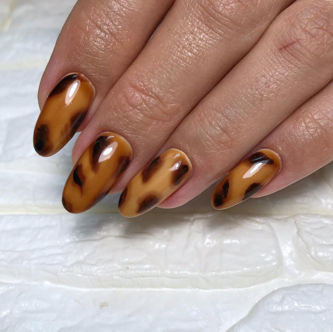 Glossy Tortoise Shell Almond Nails