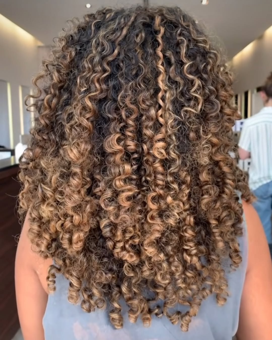 Honey Blonde Balayage On Mid-Length Curls