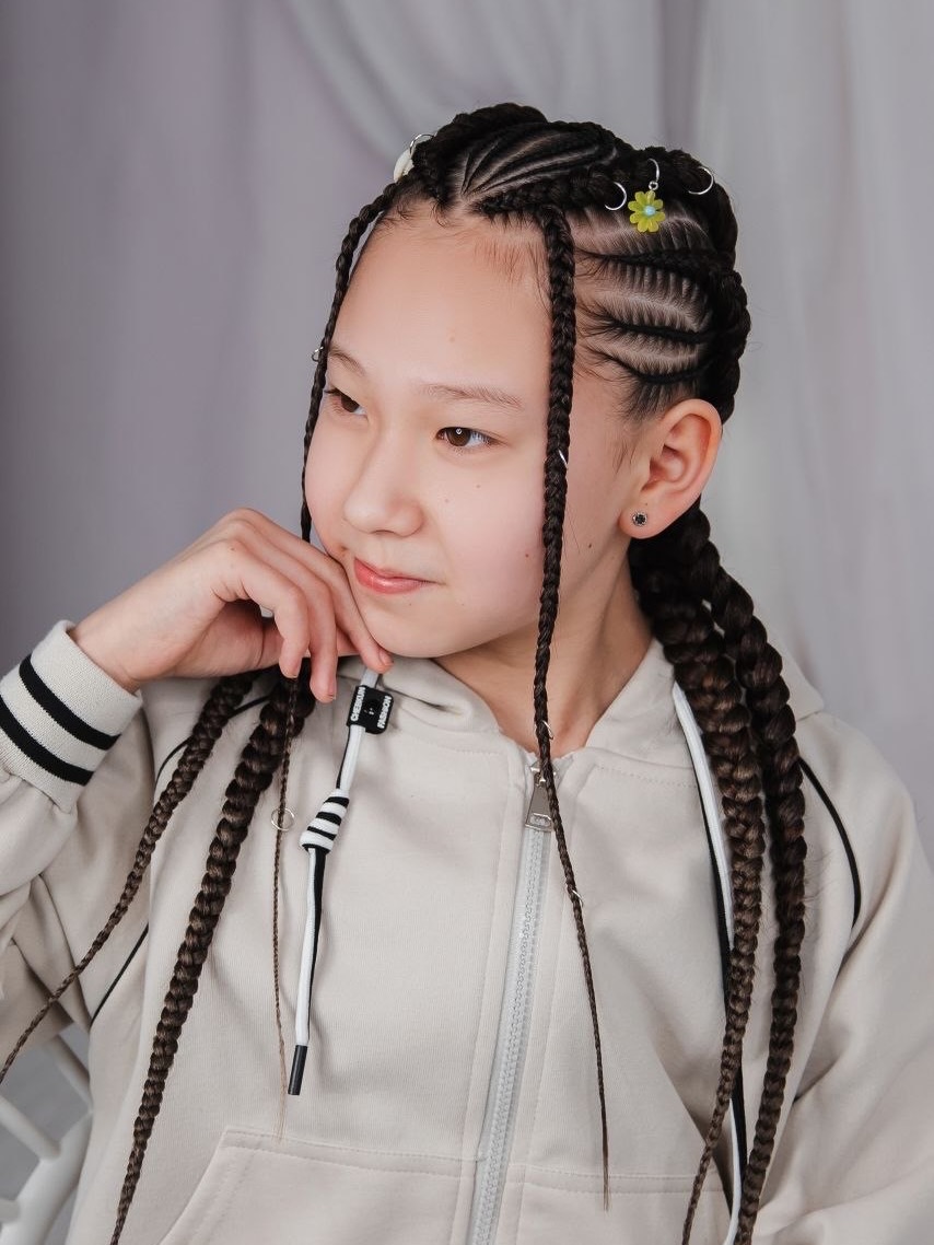 Intricate Cornrow Braids With Decorative Accessories