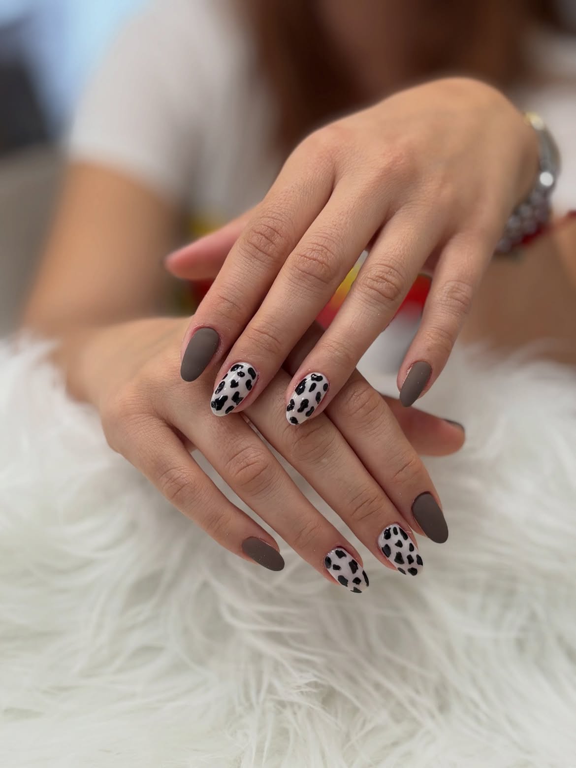 Matte Brown & Cow Print Almond Nails