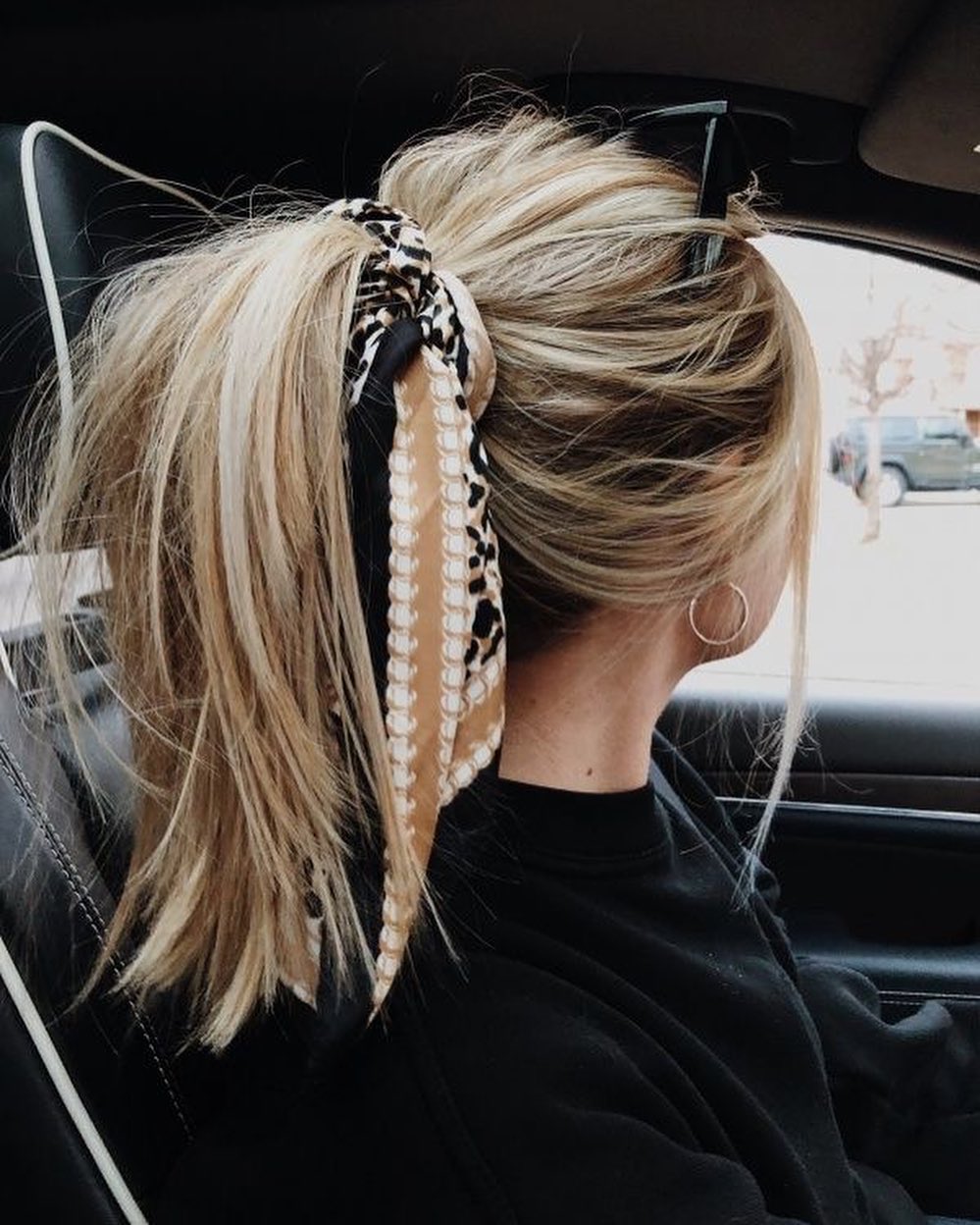 Messy High Ponytail With Chic Scarf Accent