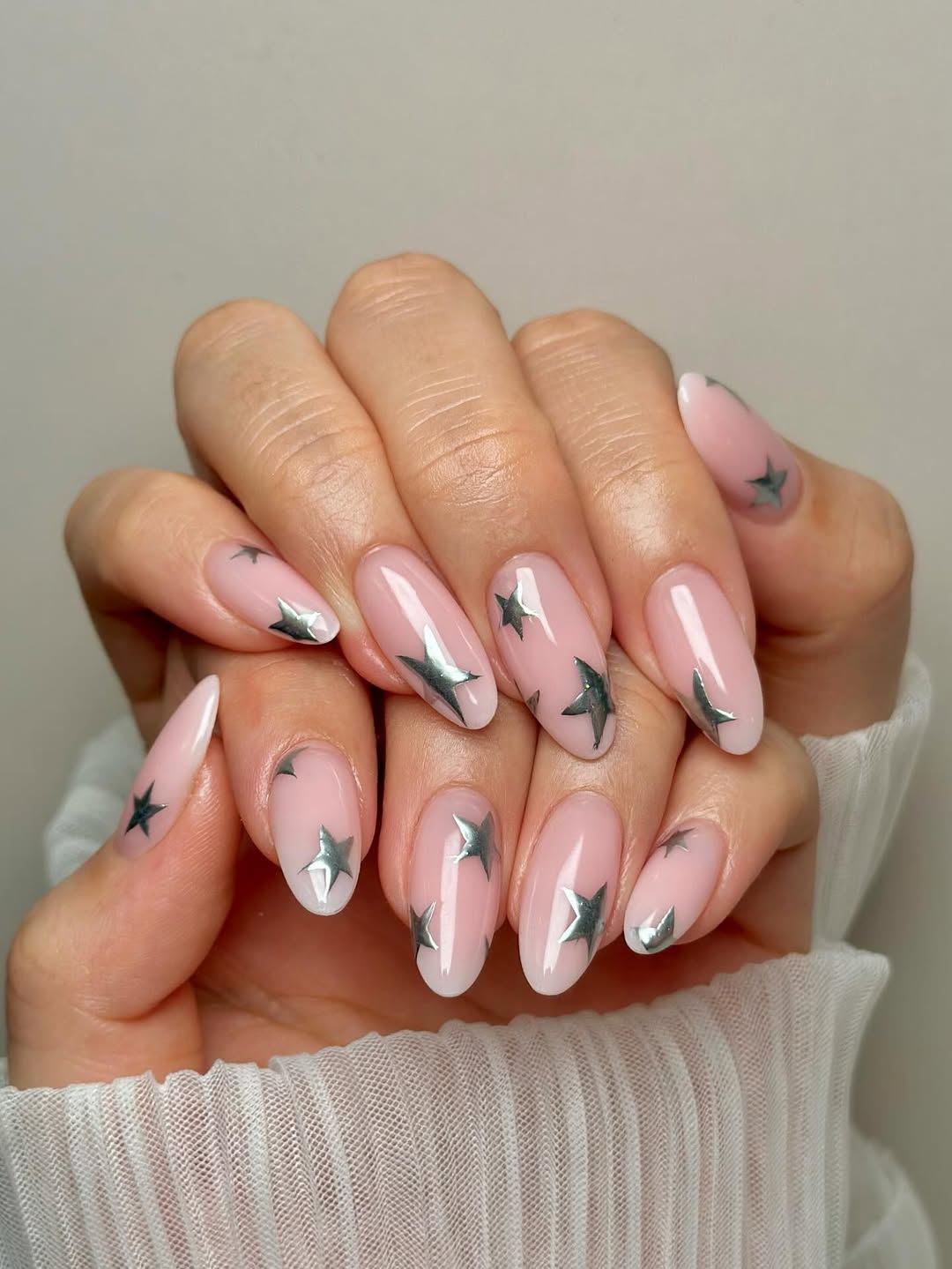 Milky Pink Oval Nails with Silver Star Decals