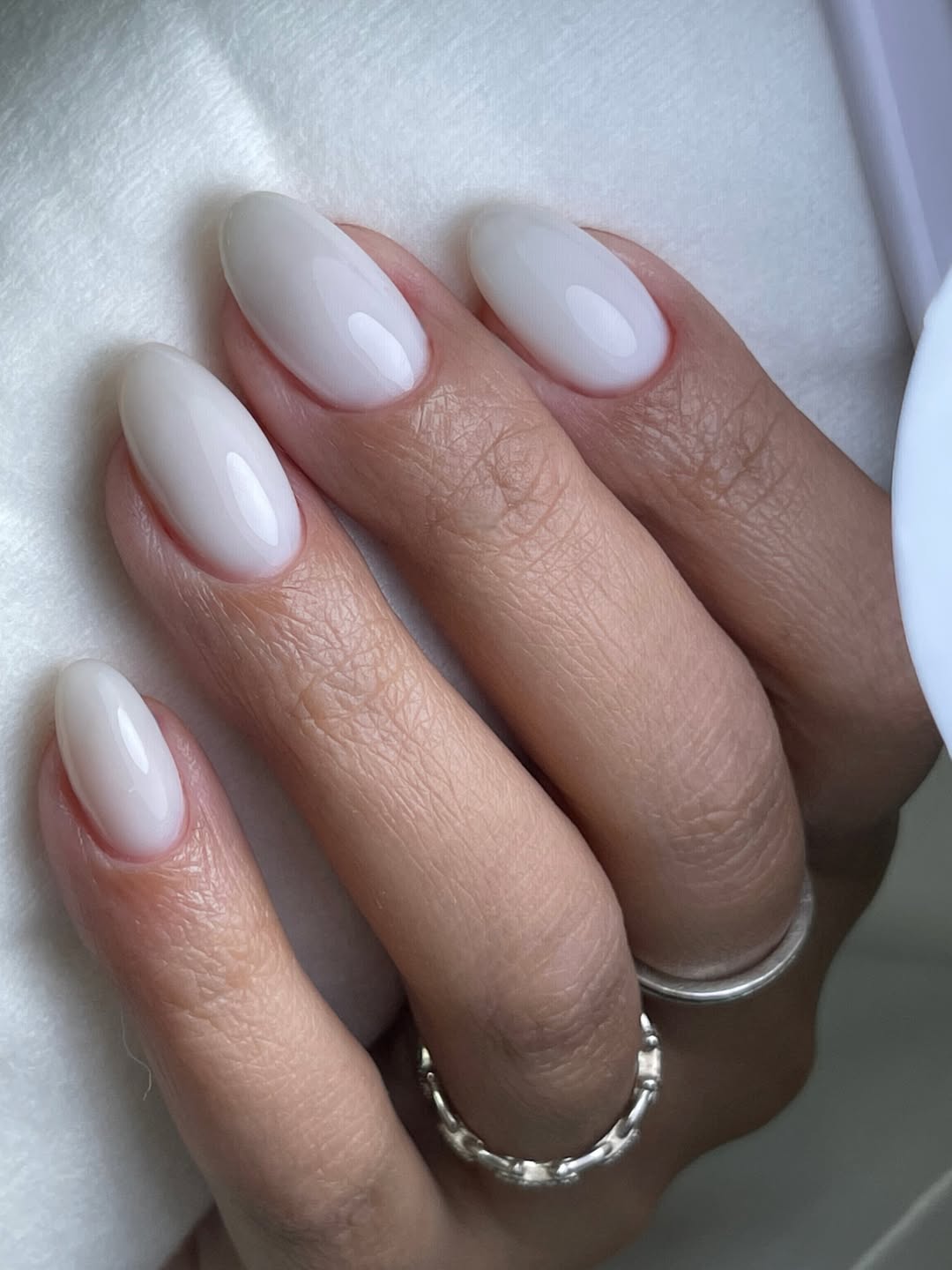 Milky White Oval Nails with High Gloss Finish