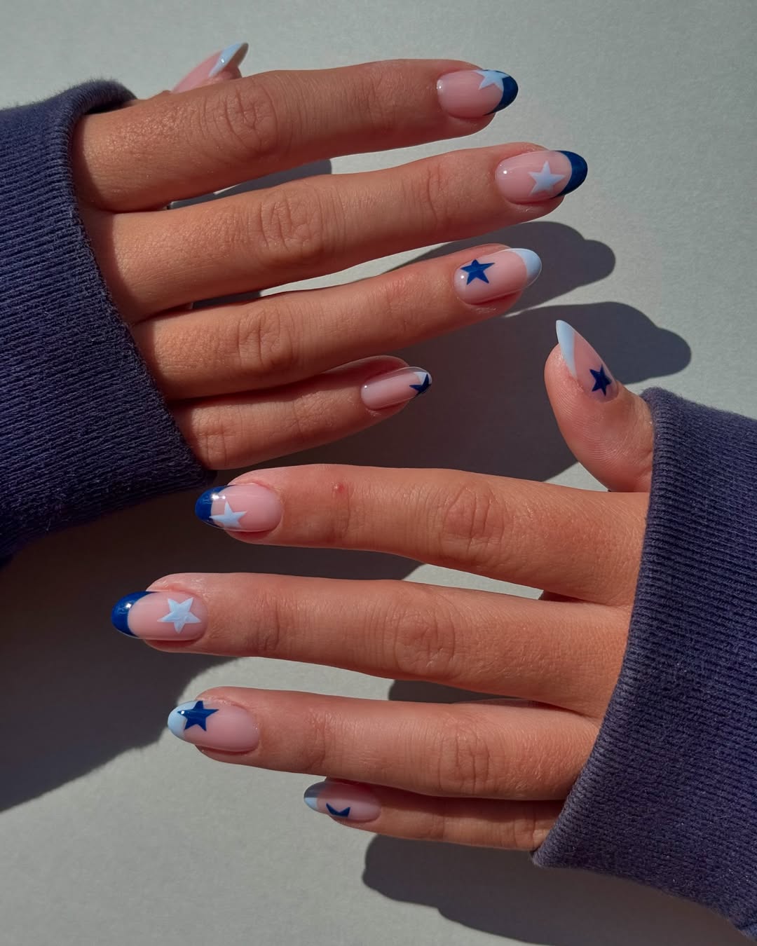Navy Blue Star French Tip Medium Almond Nails
