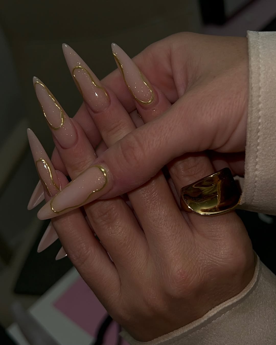 Nude Stiletto Nails With Abstract Gold Swirls