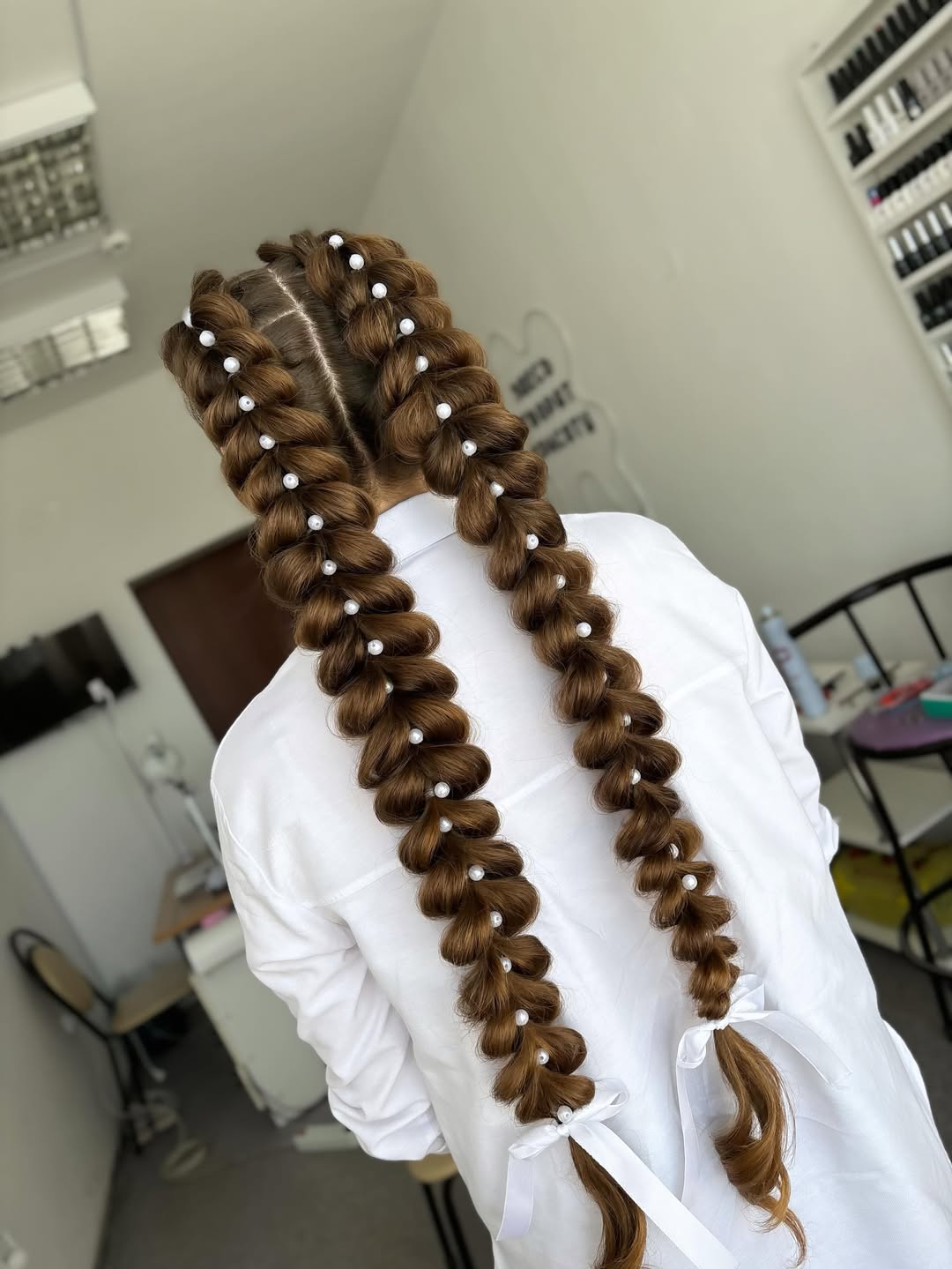 Pearl-Embellished Long Pigtail Cornrows With White Ribbons