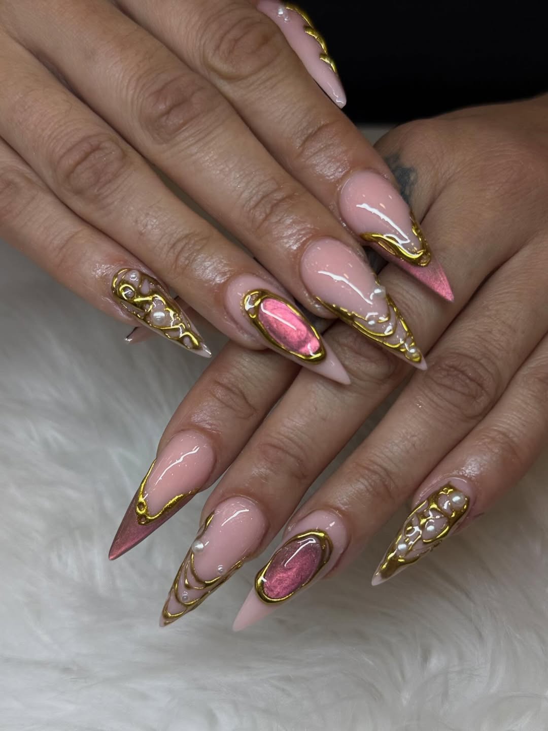 Pink and Gold Stiletto Nails with Pearly Accents