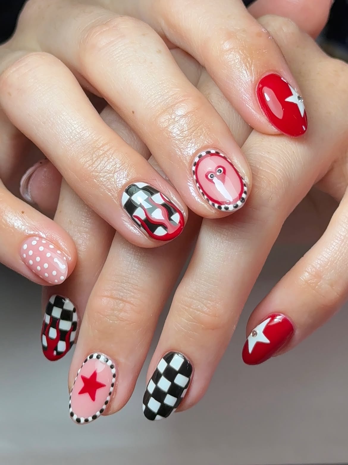 Playful Checkerboard & Star Oval Nails