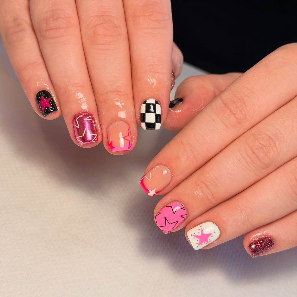 Playful Checkerboard & Starburst Nail Art