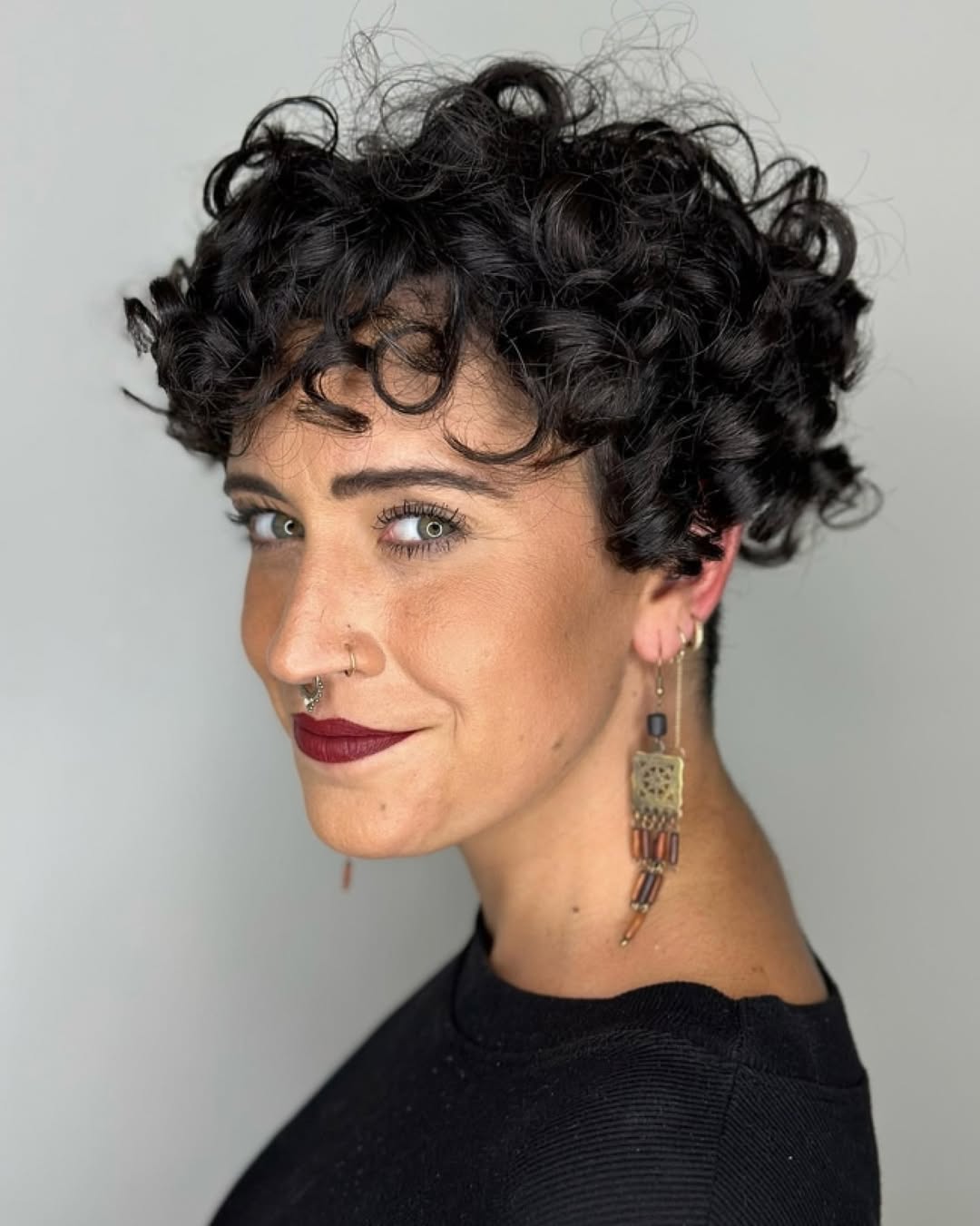 Playful Curly Pixie Cut With Finger Coils