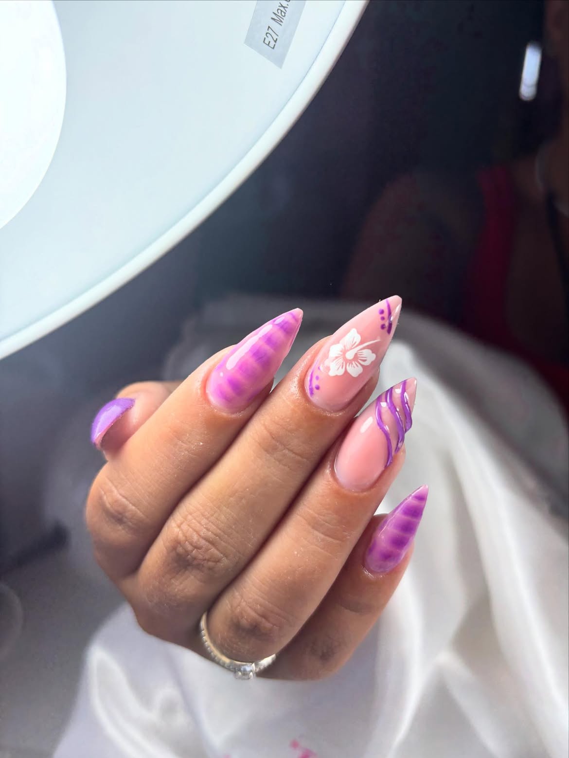 Purple Swirl Stiletto French Tips with Floral Accent