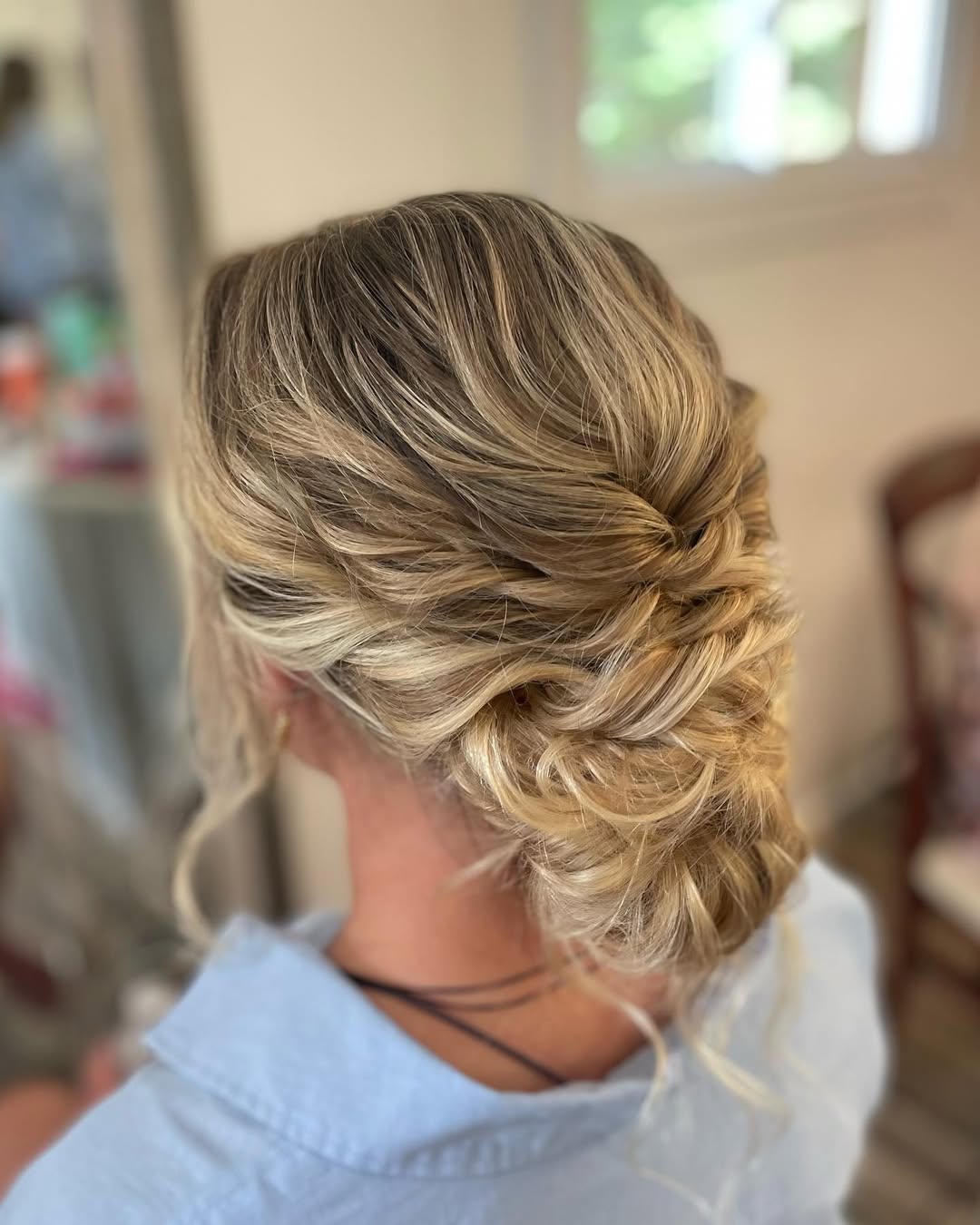 Romantic Twisted Updo With Loose Tendrils