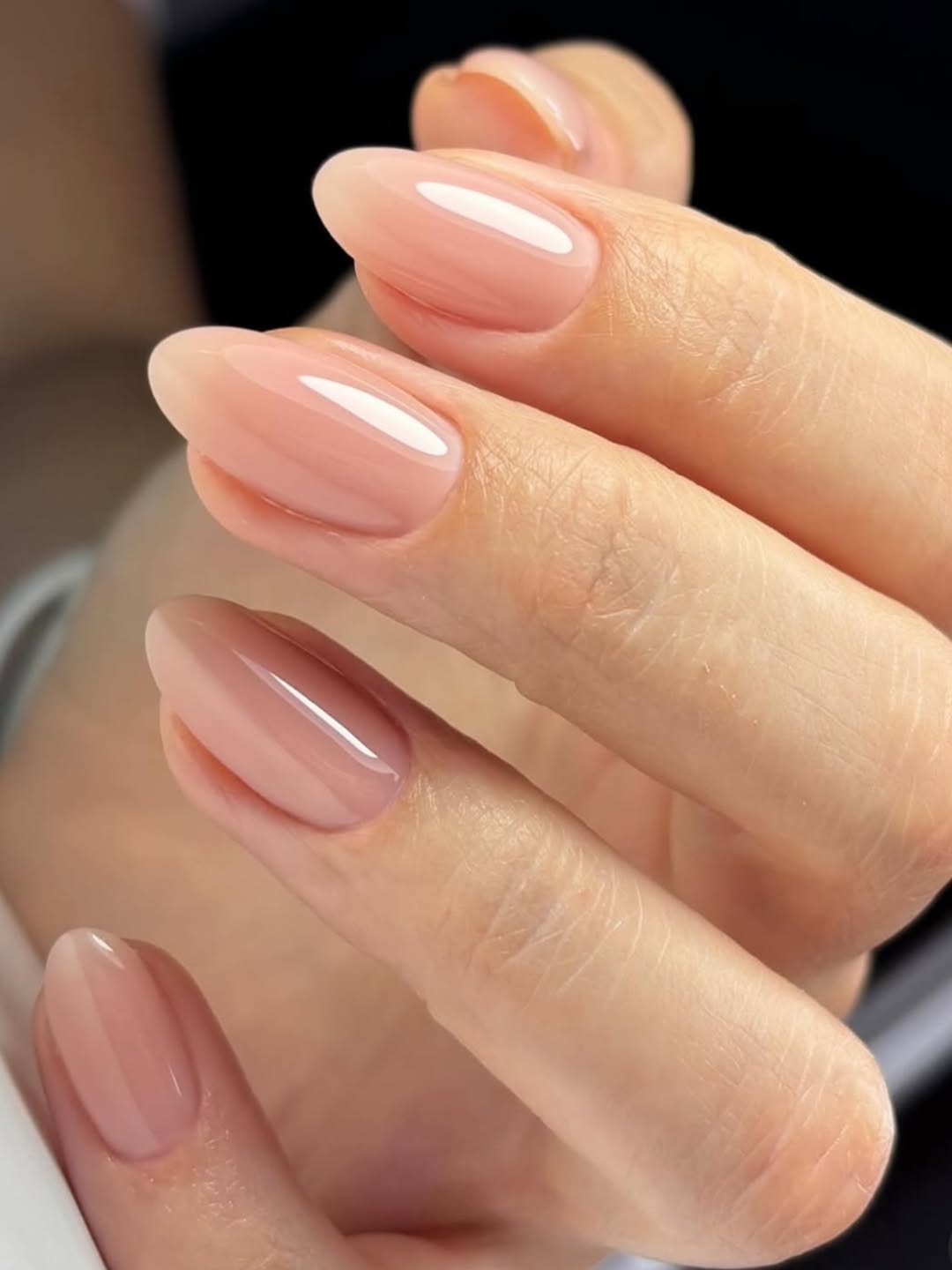 Sheer Nude Oval Gel Nails With High Gloss Finish