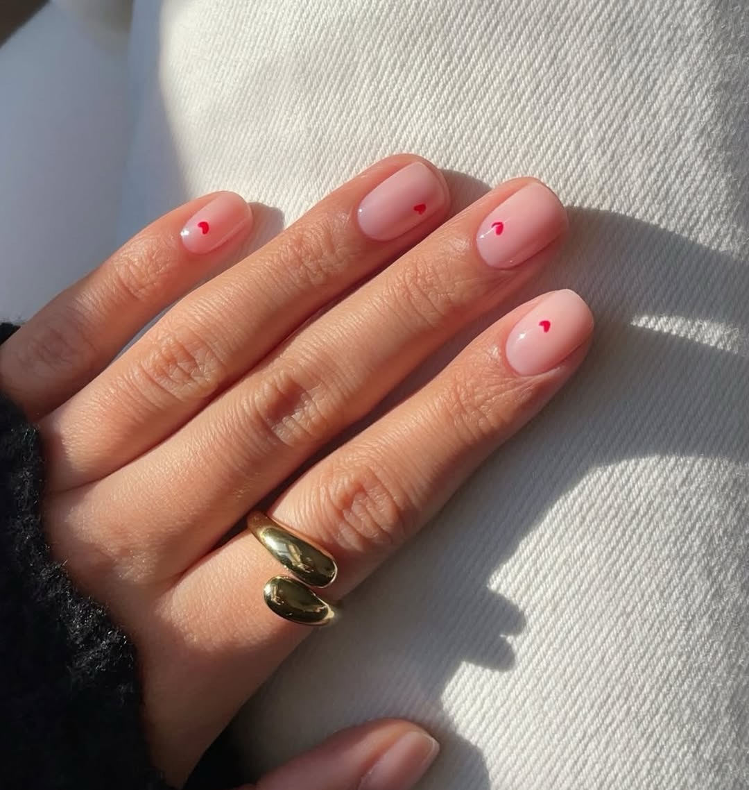 Sheer Pink Nails with Tiny Red Heart Accents