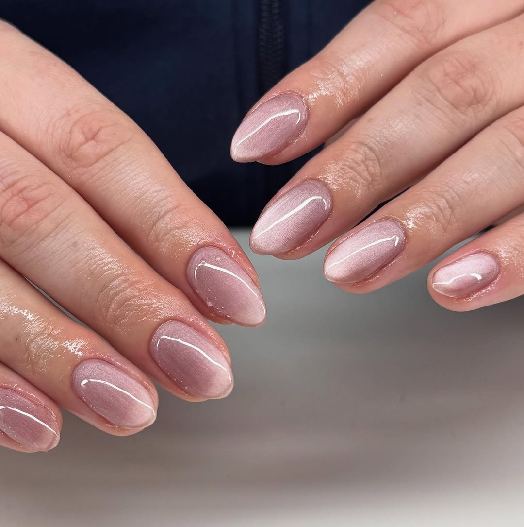 Shimmering Rose Gold Cat Eye Almond Nails
