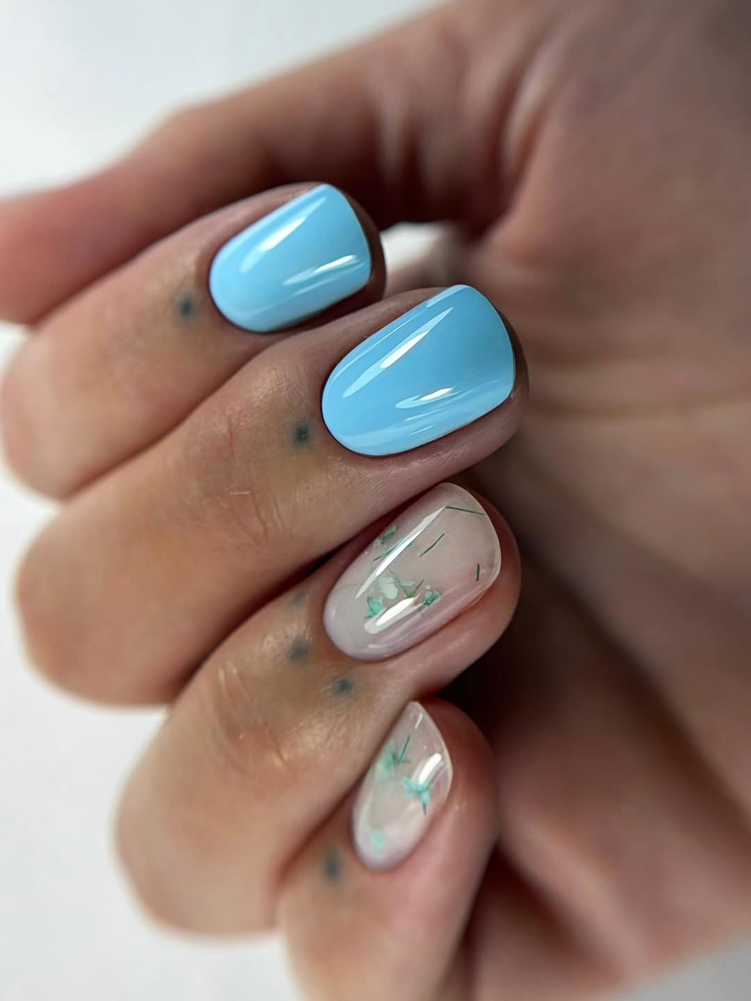 Sky Blue Glossy Oval Nails with Pressed Flowers