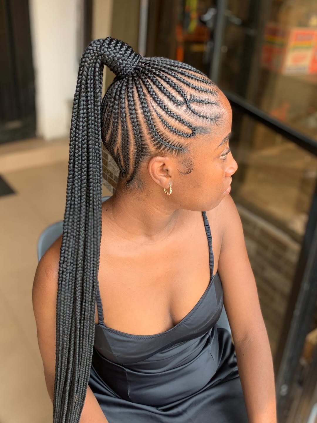 Sleek Cornrow Braids High Ponytail