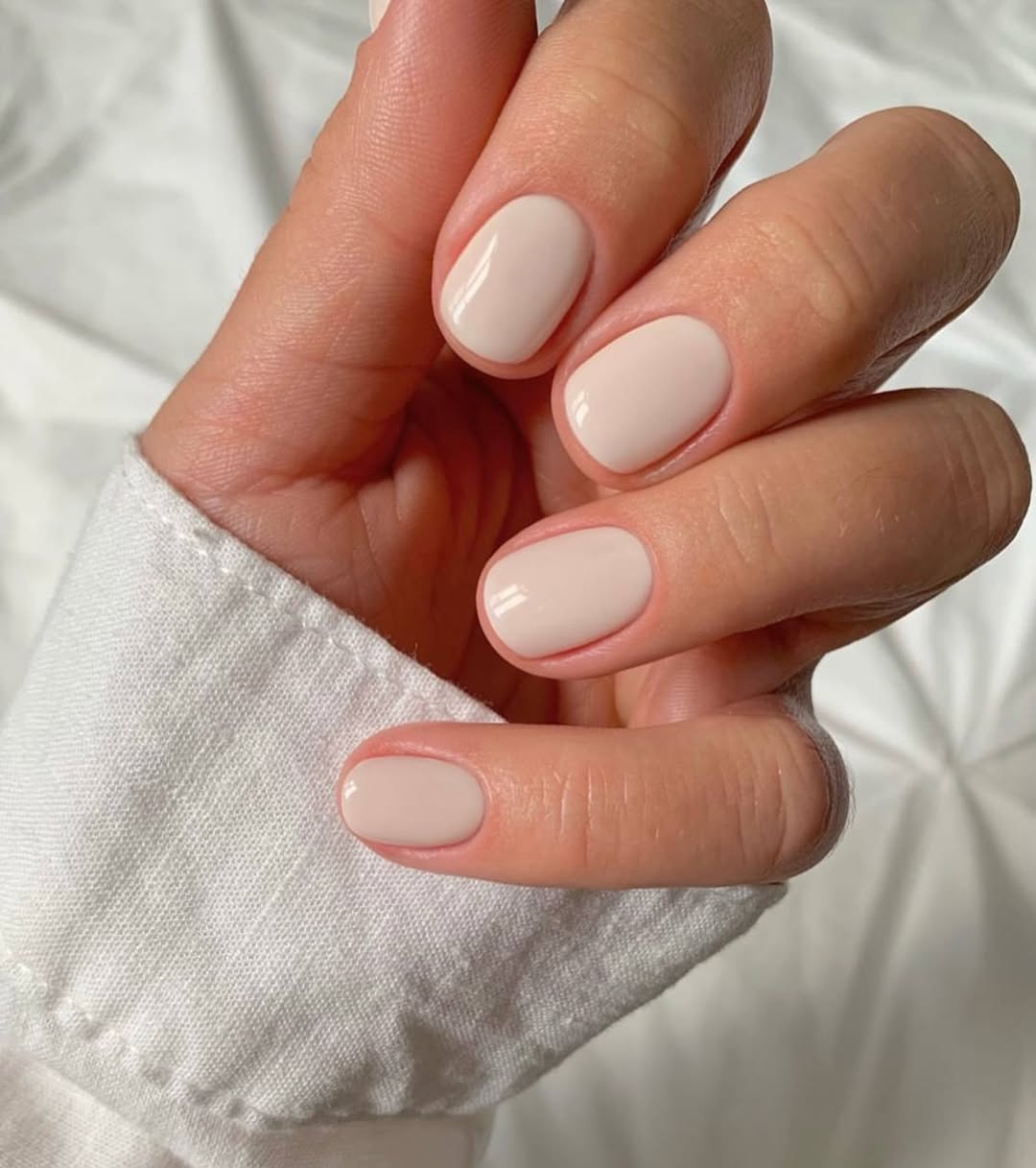 Sleek Light Beige Oval Nails
