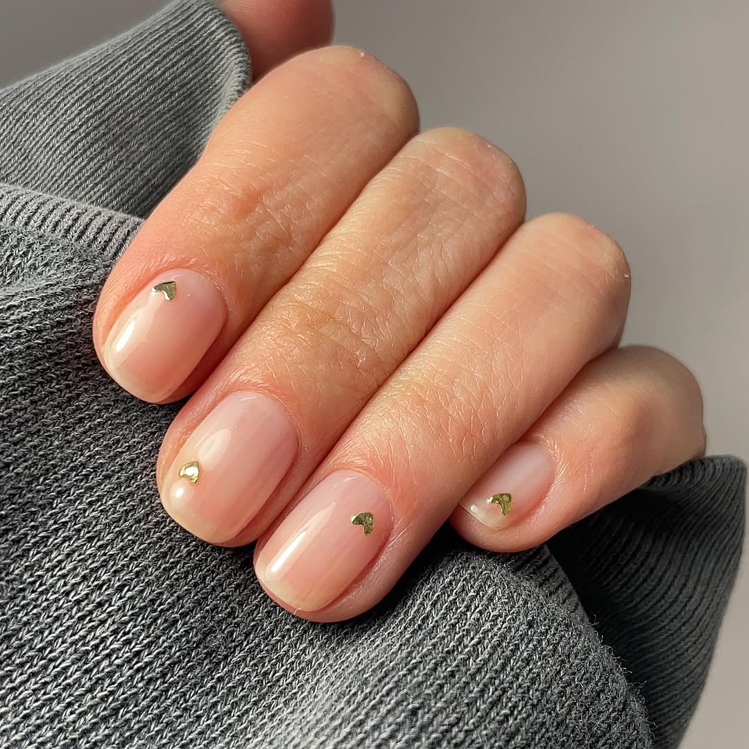Soft Milky Pink Nails with Tiny Gold Heart Charms