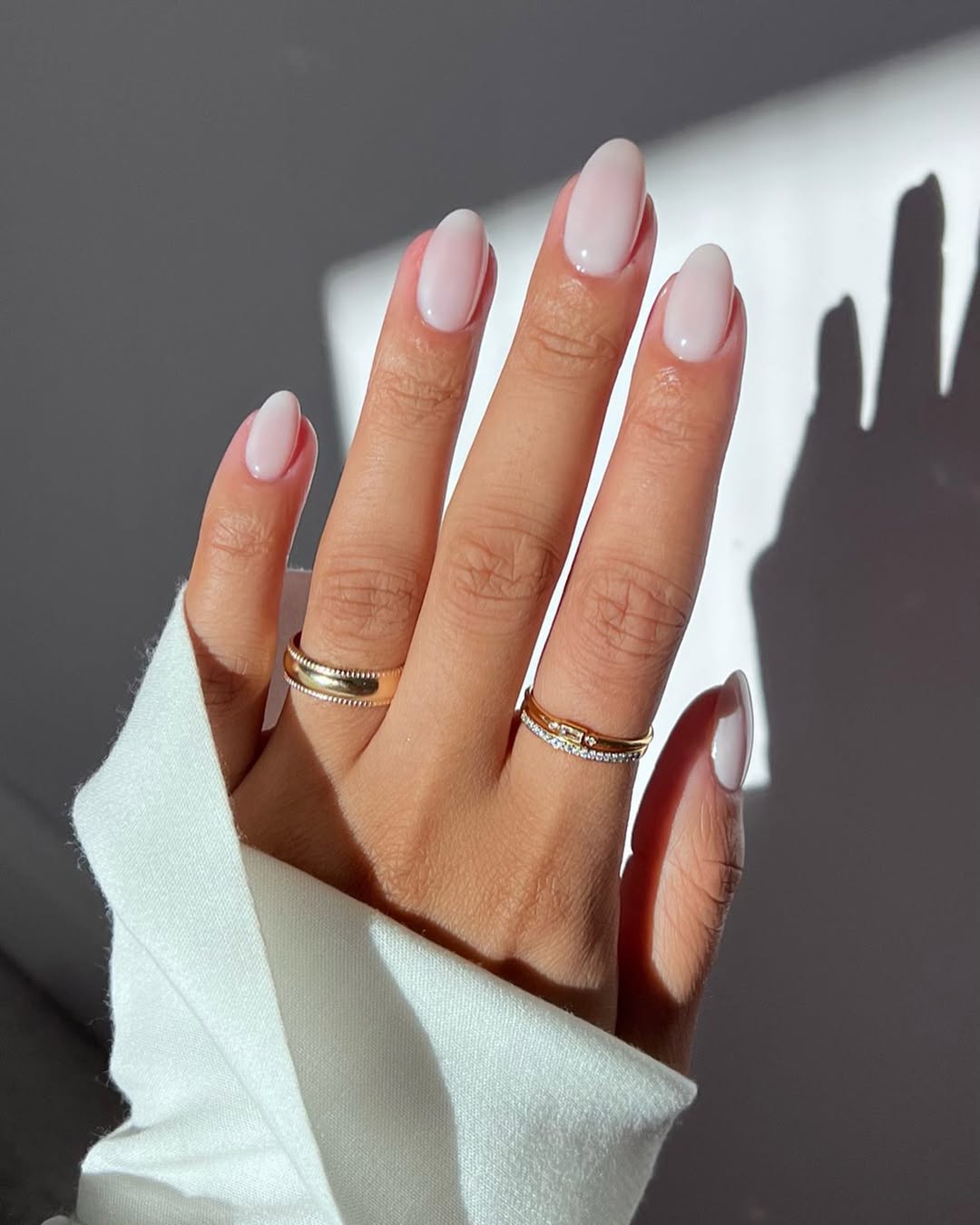 Soft Milky Pink Oval Nails With Glossy Finish
