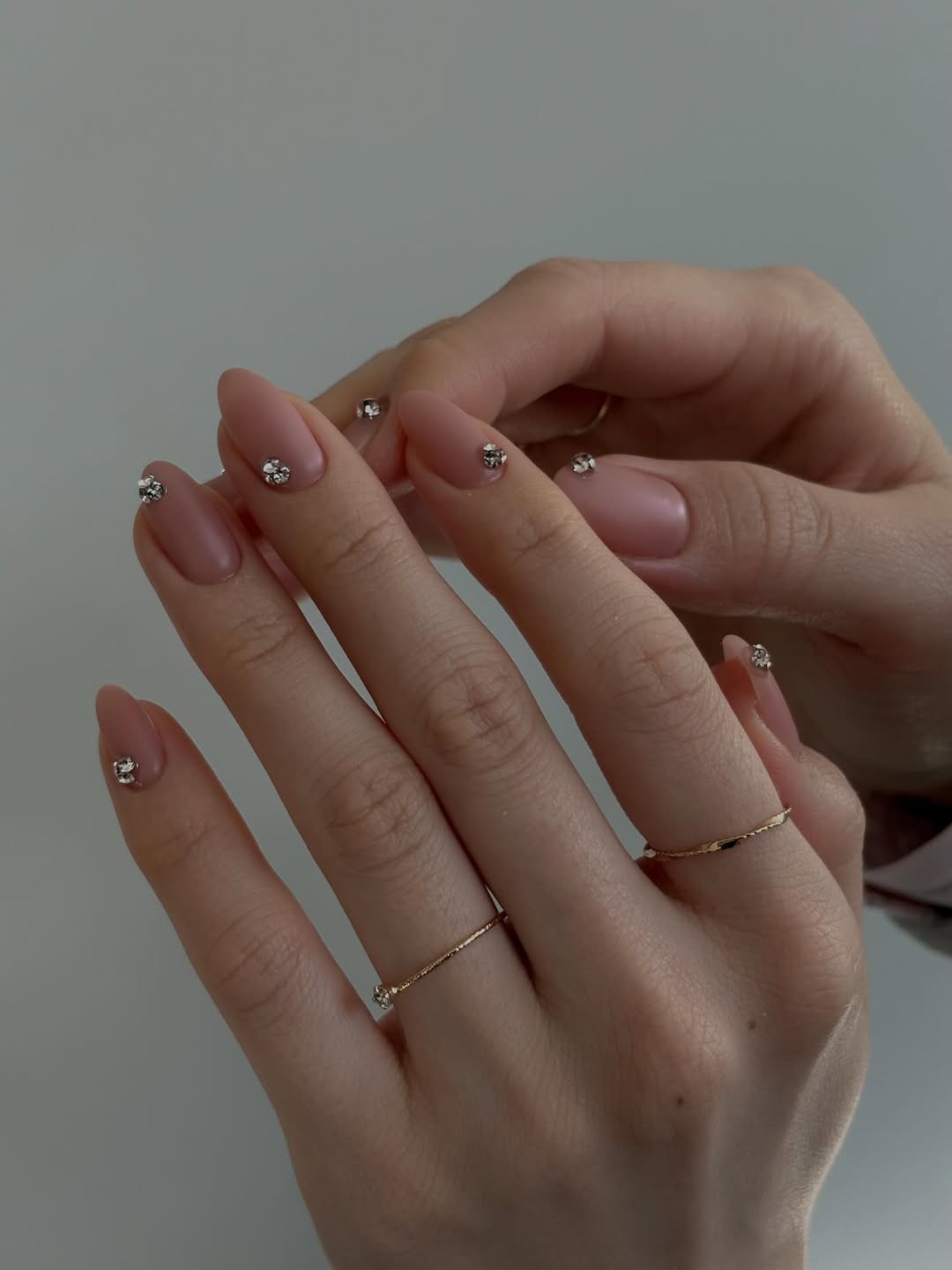 Soft Pink Almond Nails with Scattered Rhinestones