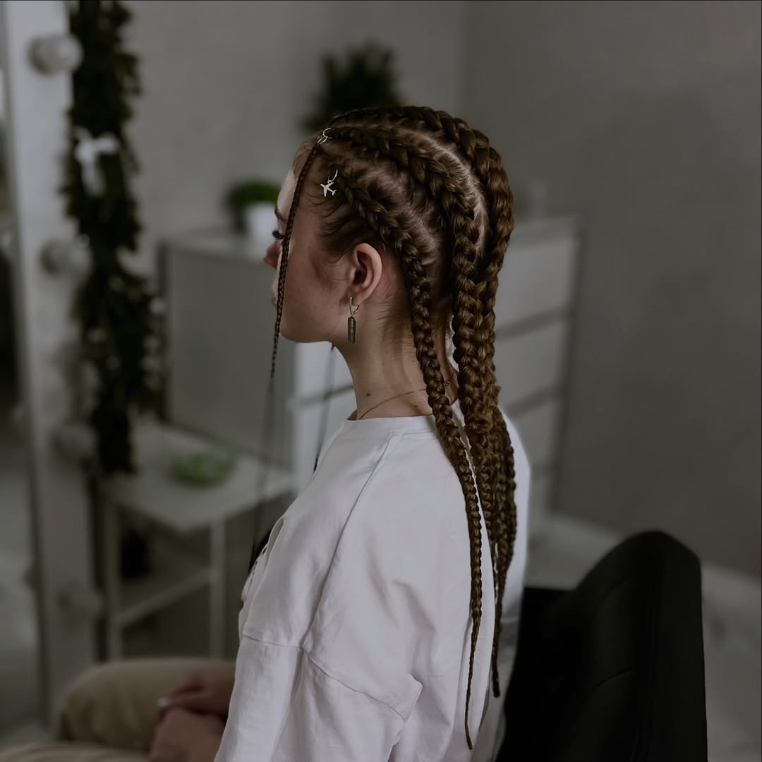Styled Cornrows With Accent Braids And Rings