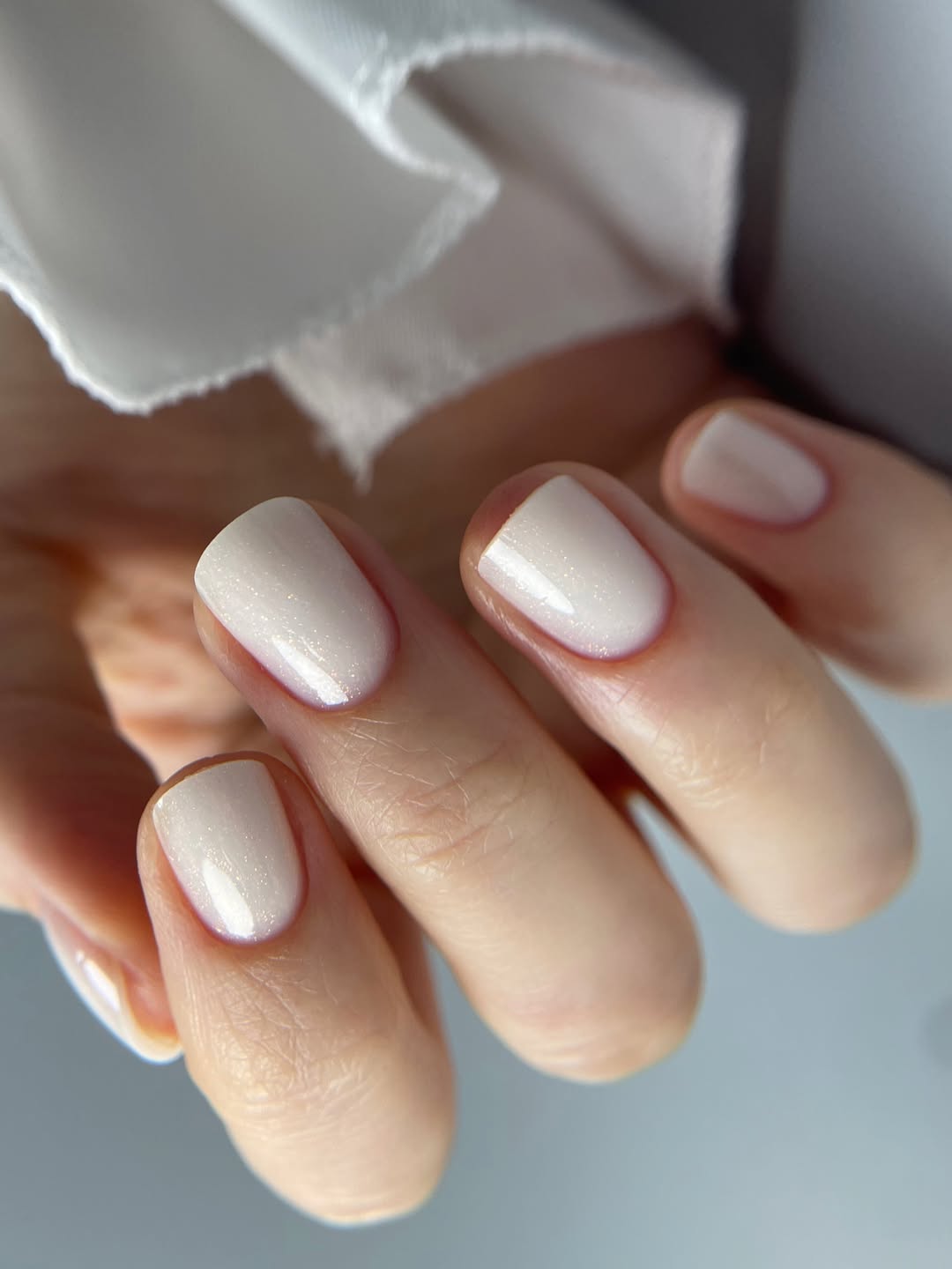 Subtle Shimmer Milky White Oval Nails