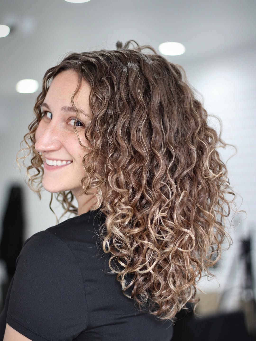 Tousled Honey Blonde Curls With Face Framing
