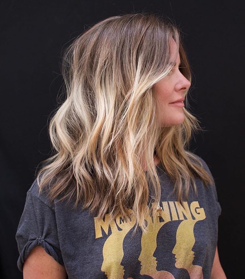 Tousled Honey Blonde Waves With Face Framing Layers